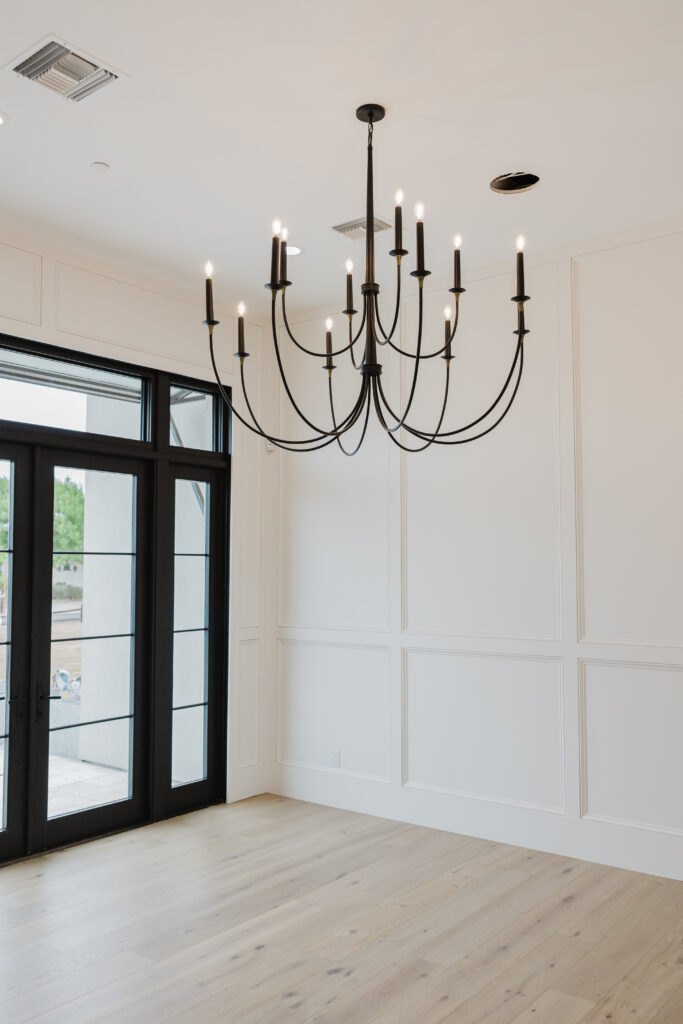 custom home photography, dining area, iron glass doors, custom lighting, interior design