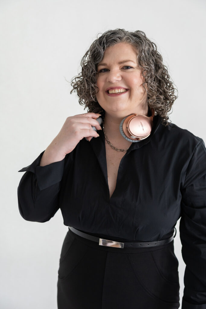 podcast headphones on Greta for a headshot, branding session for 7 figure earner